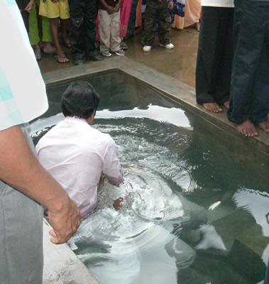 A new believer is baptized.