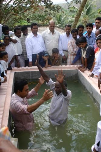 A new believer is baptized.